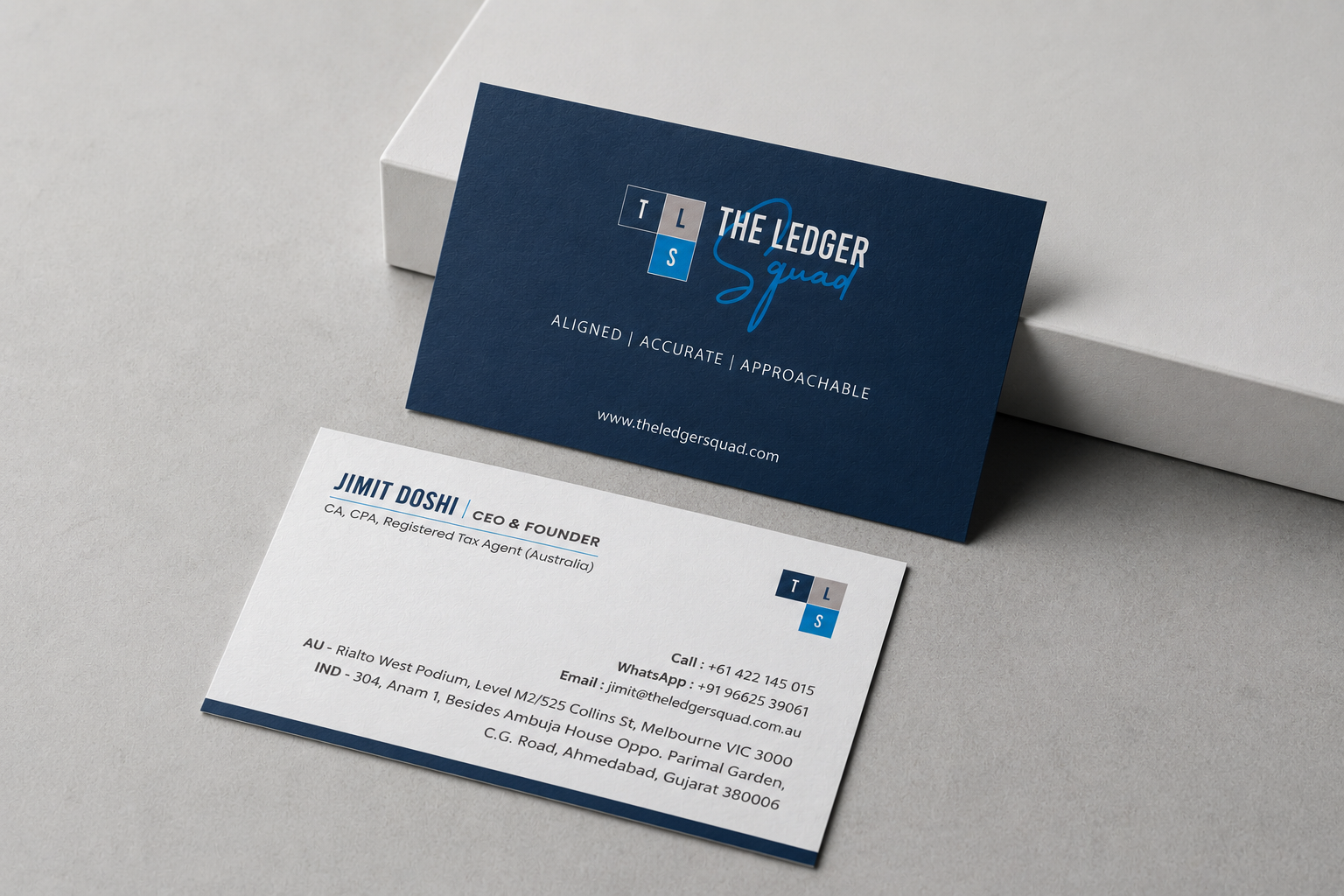 The Ledger Squad visiting card — navy front and white back